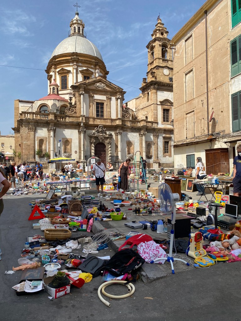 This image has an empty alt attribute; its file name is flea-market-next-to-beautiful-church.jpg