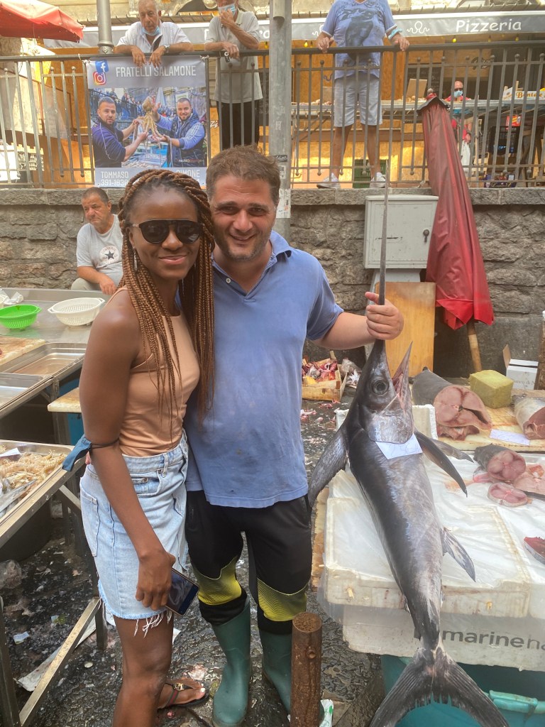 This image has an empty alt attribute; its file name is nneka-at-catania-fish-market.jpg