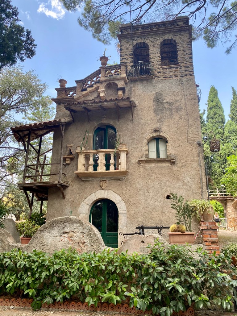 This image has an empty alt attribute; its file name is old-building-in-taormina-park-2.jpg