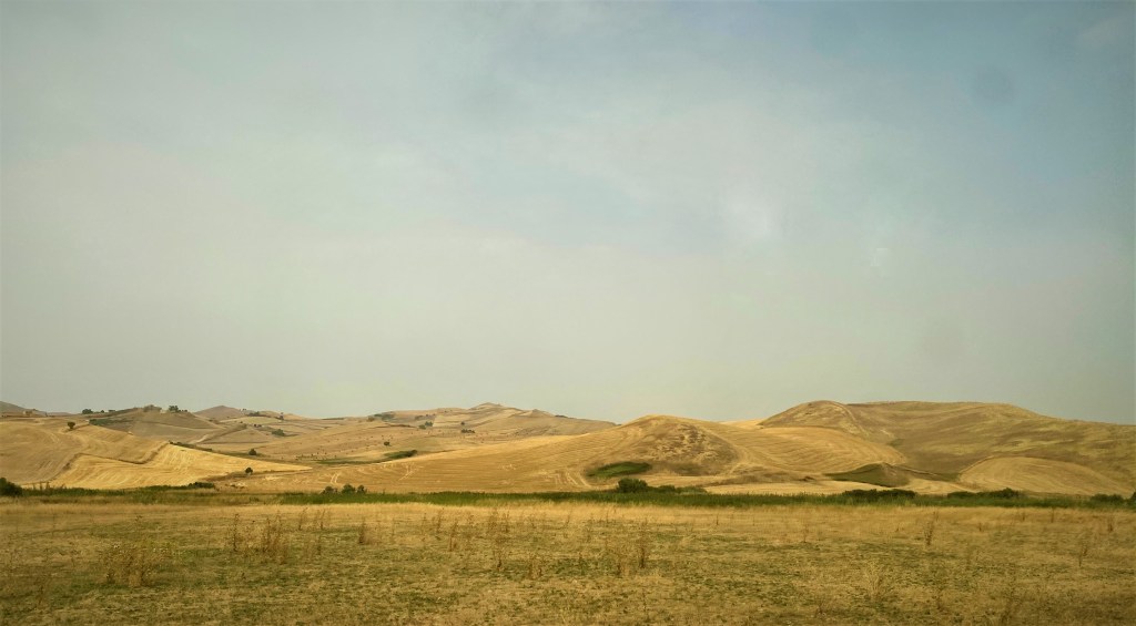 This image has an empty alt attribute; its file name is sicilian-countryide-from-the-train.jpg